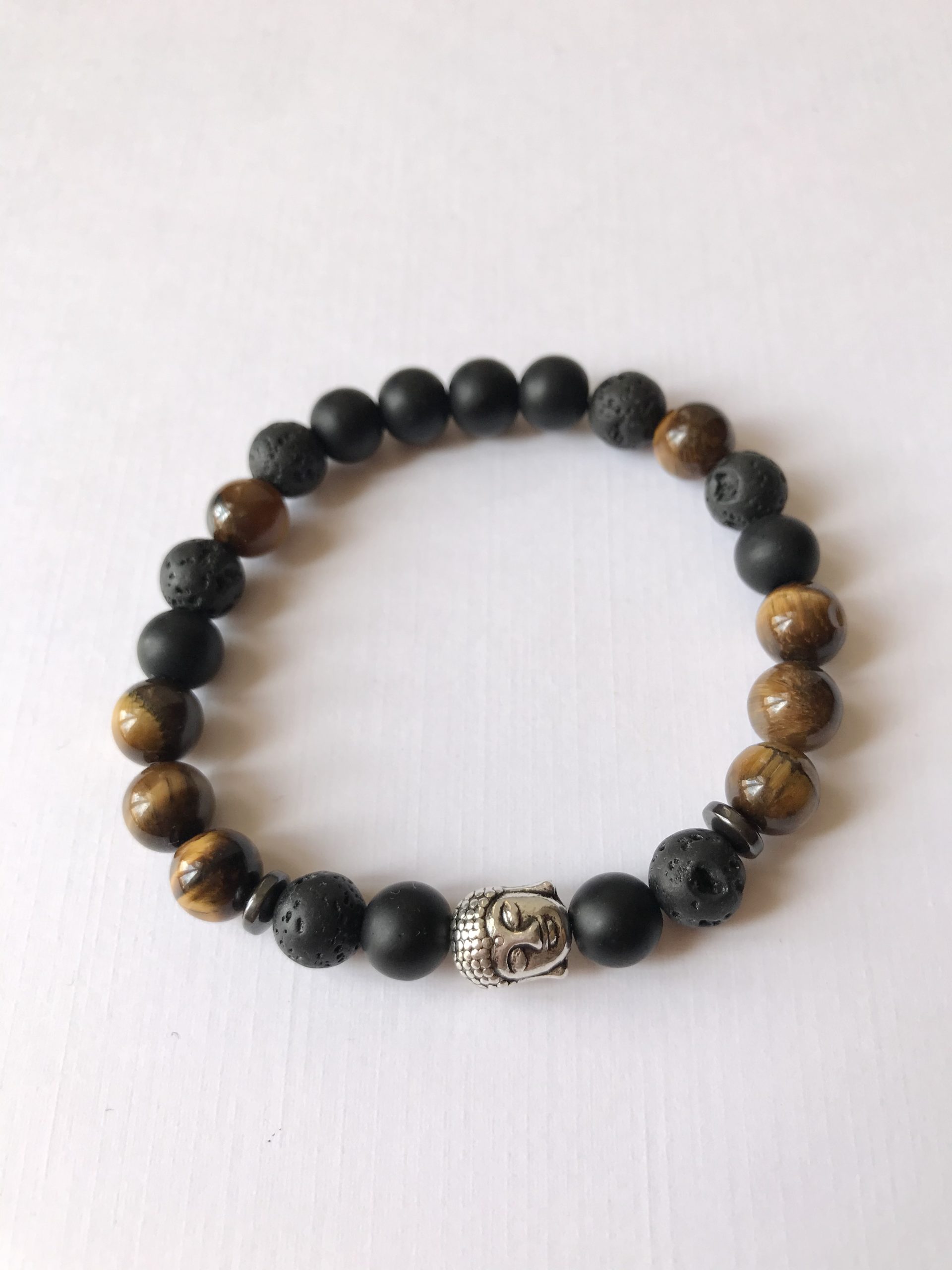 Tigrisszem-lávakő és ónix karkötő buddha medállal